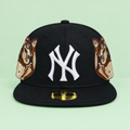 Black flat-brim cap with white front embroidery and portrait patches on mint green background