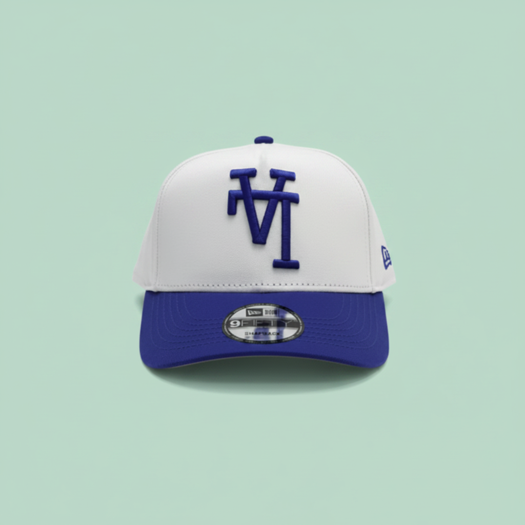 White and blue embroidered cap front view on a pastel mint green background