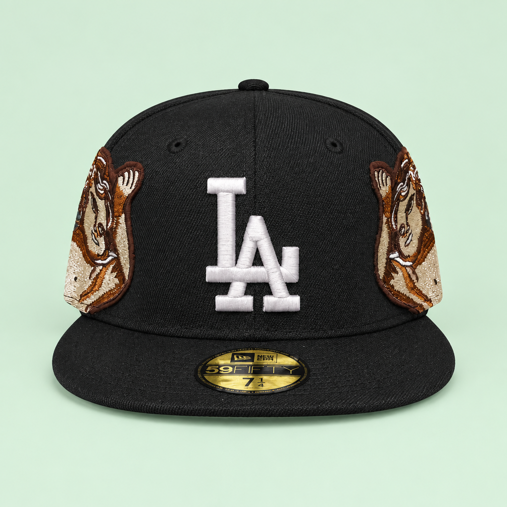 Black flat-brim cap with white front embroidery and portrait patches on pastel mint green background