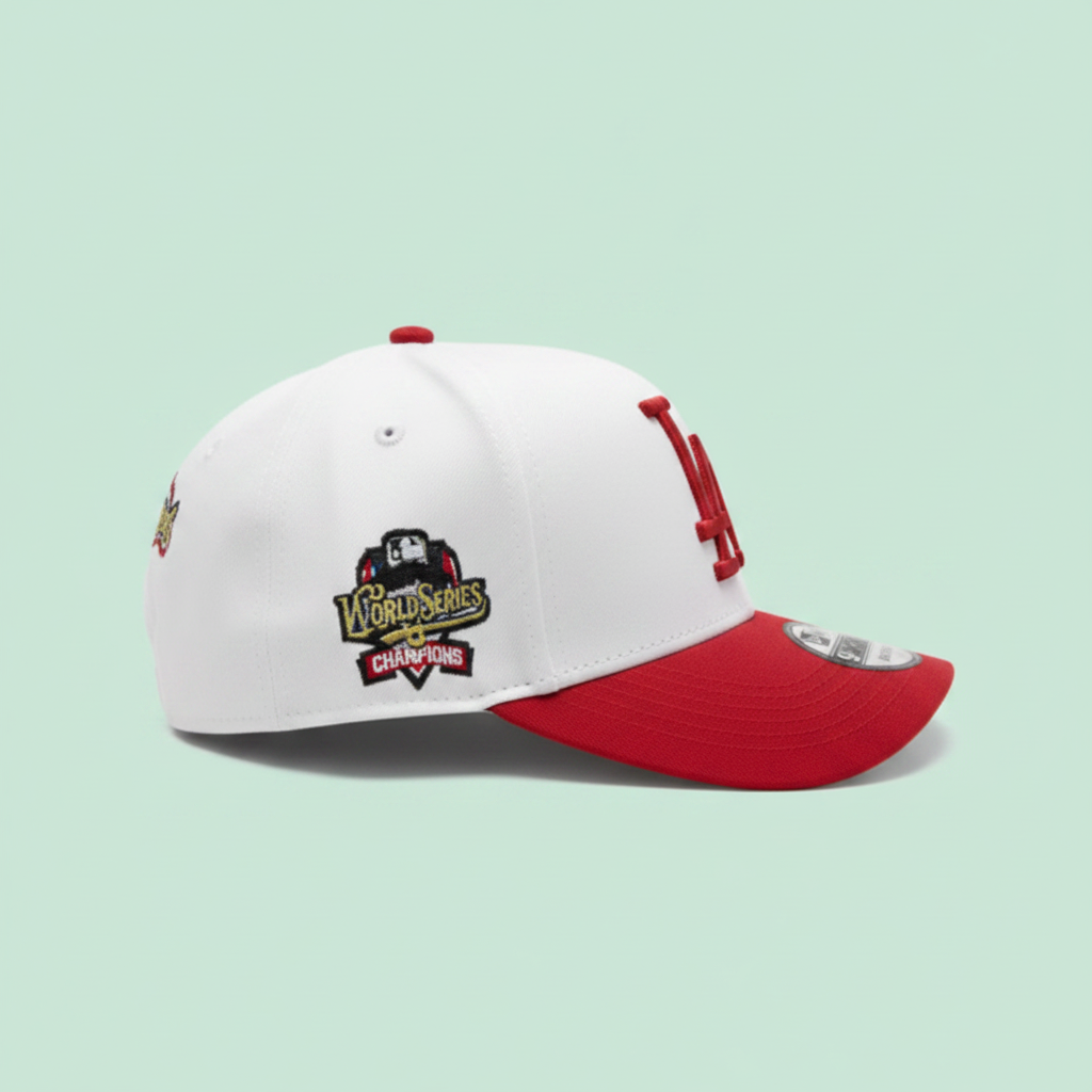 White and red embroidered baseball cap right side view on a pastel mint green background
