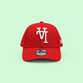 Red cap with white raised embroidery, long-range front view on pastel mint background